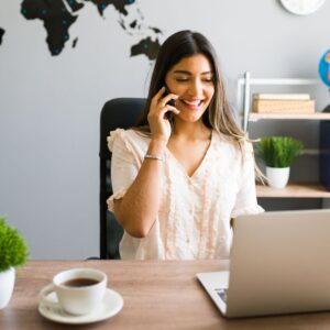 woman using phone and computer