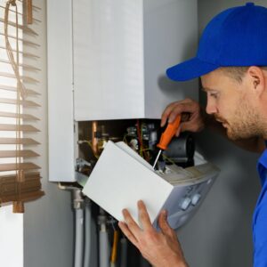 technician performing apartment maintenance