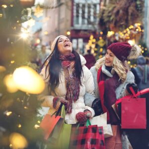 two friends happily shopping together