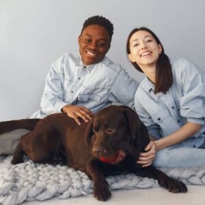 two people with dog