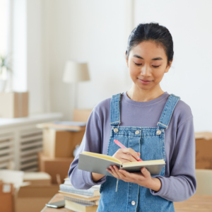 Woman writing in a notebook. 