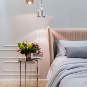 flowers sitting on night table next to bed