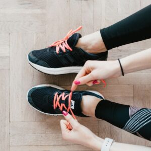 person putting shoes on