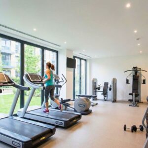 woman using apartment work out room